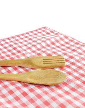 Wooden cooking utensils on napkin