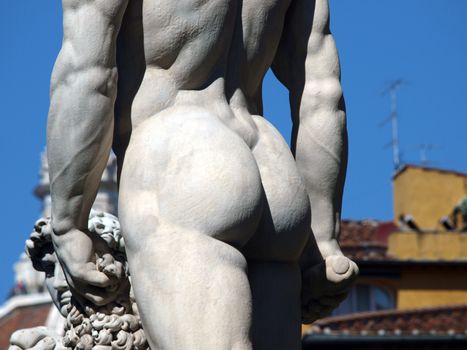 Florence - Sculpture Hercules and Cacus by Bandinelli. The white marble sculpture Hercules and Cacus is to the right of the entrance of the Palazzo Vecchio in the Piazza della Signoria, Florence, Italy.