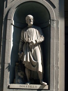 Donatello in the Niches of the Uffizi Colonnade, Florence. The niches beneath the porticos of the Uffizi Gallery were originally designed by Vasari purely as architectural features but by the first half of the 19th Century they were occupied by 28 statues of famous people from the worlds of politics, art, literature, science, the judiciary and also religious figures.