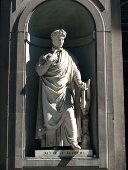 Dante Alighieri in the Niches of the Uffizi Colonnade, Florence.The niches beneath the porticos of the Uffizi Gallery were originally designed by Vasari purely as architectural features but by the first half of the 19th Century they were occupied by 28 statues of famous people from the worlds of politics, art, literature, science, the judiciary and also religious figures.