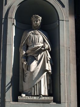 Boccaccio in the Niches of the Uffizi Colonnade, Florence. The niches beneath the porticos of the Uffizi Gallery were originally designed by Vasari purely as architectural features but by the first half of the 19th Century they were occupied by 28 statues of famous people from the worlds of politics, art, literature, science, the judiciary and also religious figures.