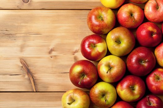 Apples on wooden table, top view nature background with copy space