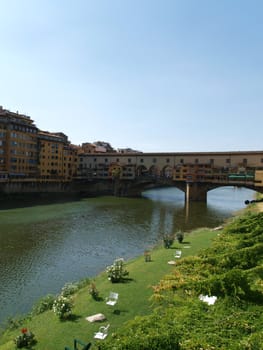 Florence - View of the Ponte Vecchio. The Ponte Vecchio /Old Bridge/ is a Medieval bridge over the Arno River, in Florence, Italy