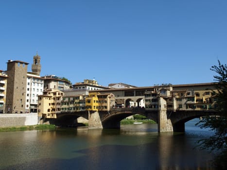 Florence - View of the Ponte Vecchio. The Ponte Vecchio /Old Bridge/ is a Medieval bridge over the Arno River, in Florence, Italy
