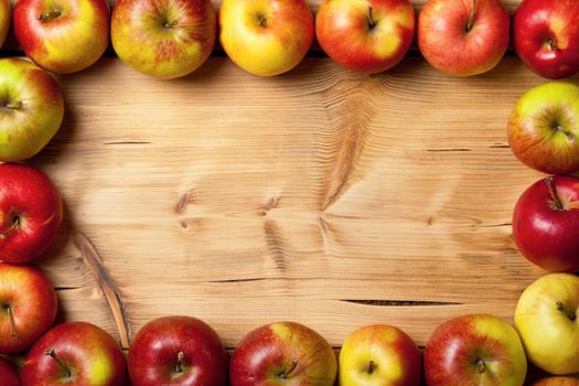 Apples on wooden table. Fresh fruit background with copy space