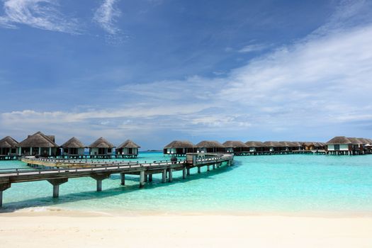 Beautiful beach with water bungalows at Maldives