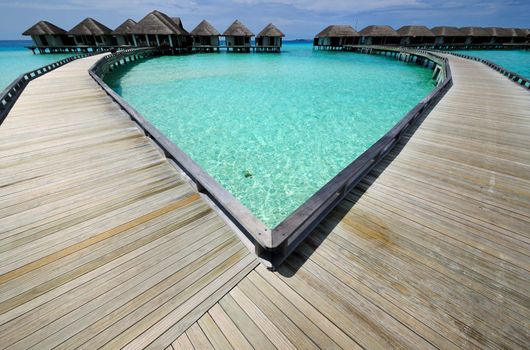 Beautiful beach with water bungalows at Maldives