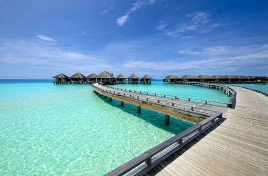 Beautiful beach with water bungalows at Maldives