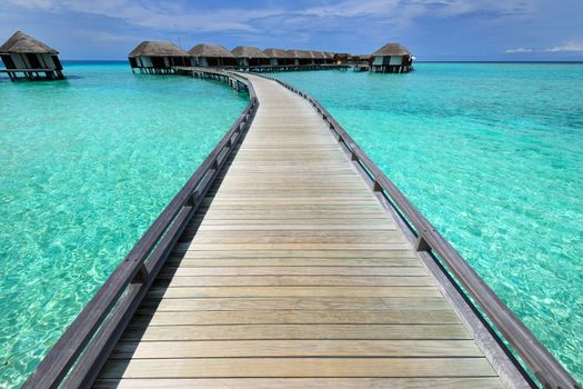 Beautiful beach with water bungalows at Maldives