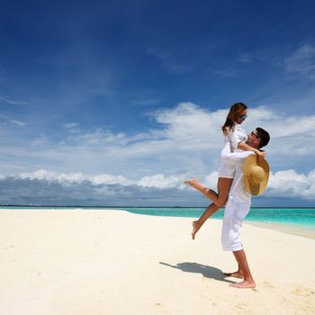 Couple on a tropical beach at Maldives