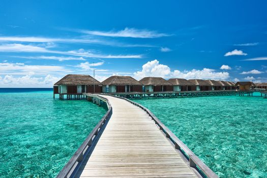 Beautiful beach with water bungalows at Maldives