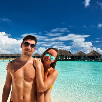 Couple on a tropical beach at Maldives