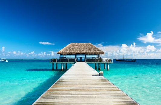 Beautiful beach with jetty at Maldives