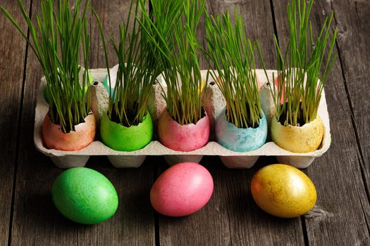 Colored easter eggs on wooden table