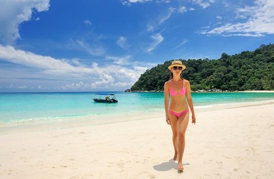 Woman in bikini at tropical beach