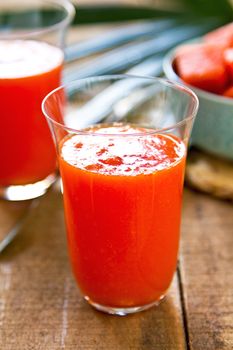 Fresh Papaya smoothie by some papaya in a bowl