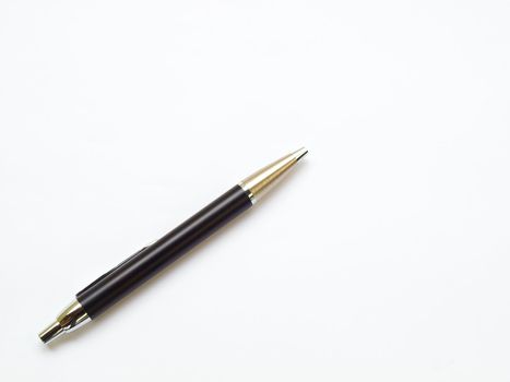 Black ball pen isolated on white background on buttom left