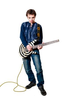 Young guitarist with electric guitar on white background