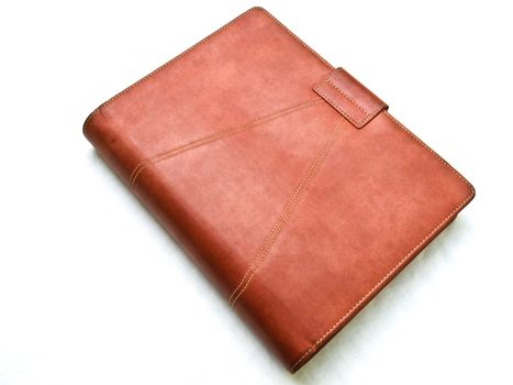 Red brown leather organizer isolated by white