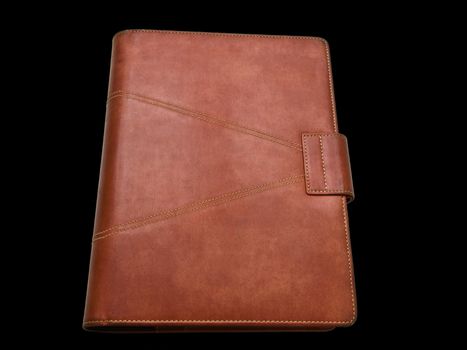 Red brown leather organizer isolated by black