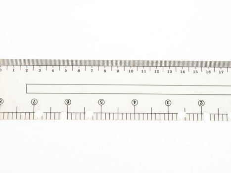 Closeup of used plastic ruler isolated on white background