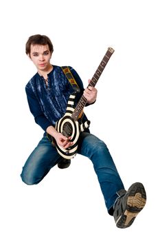 Young guitarist with electric guitar on white background