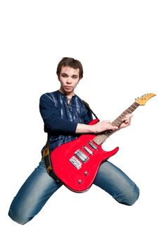 Young guitarist with electric guitar on white background