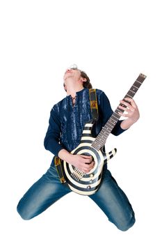 Young guitarist with electric guitar on white background