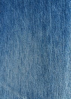 Striped textured used blue jeans denim fabric grunge background