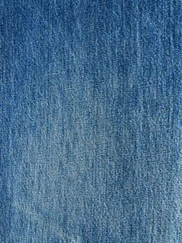 Striped textured used blue jeans denim fabric grunge background