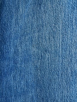 Striped textured used blue jeans denim fabric grunge background