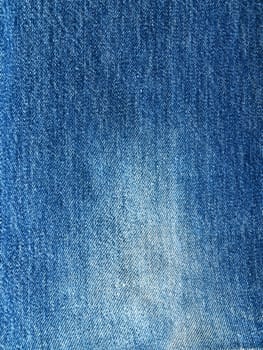 Striped textured used blue jeans denim fabric grunge background