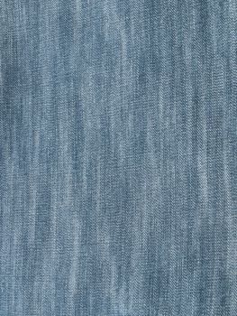 Striped textured used blue jeans denim fabric grunge background