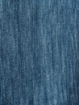 Striped textured used blue jeans denim fabric grunge background