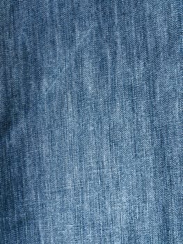 Striped textured used blue jeans denim fabric grunge background