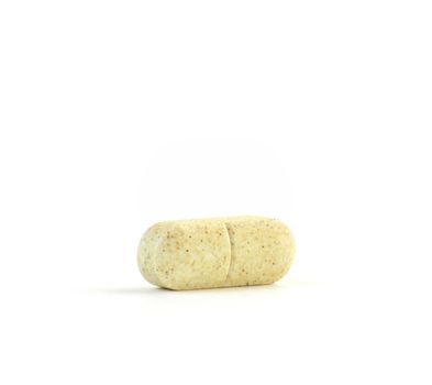 Speckled Vitamin C Tablet Isolated Against a Pure White Background