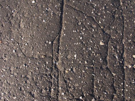 Old asphalt road surface texture with fissure