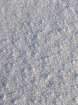 Texture of snow surface on sunny day