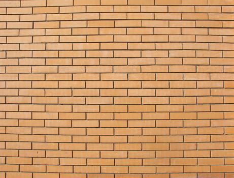 Beige colored fine brick wall texture