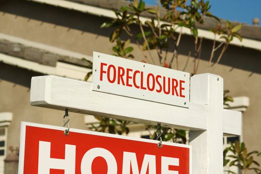 Foreclosure Real Estate Sign in Front of Home