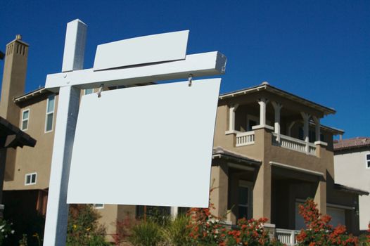 Blank Real Estate Sign in Front of Beautiful New Home