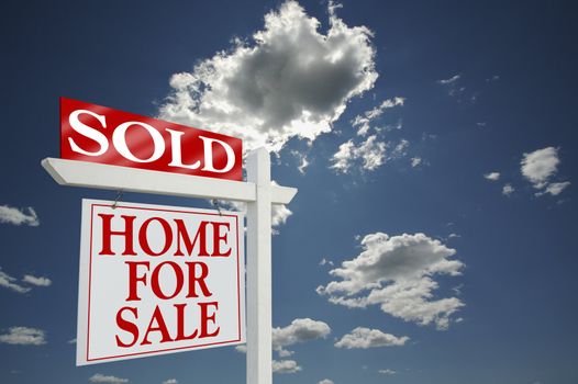 Sold Home for Sale sign on dramatic clouds background with room for your message
