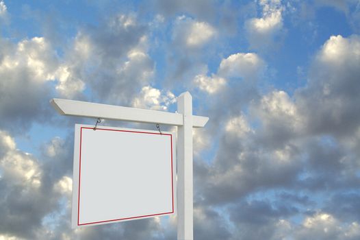 Blank Real Estate Sign on Dramatic Cloudy Sky Background.