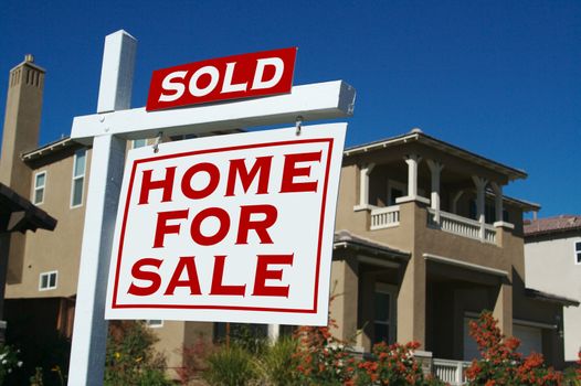 Sold Home For Sale Sign in Front of New House
