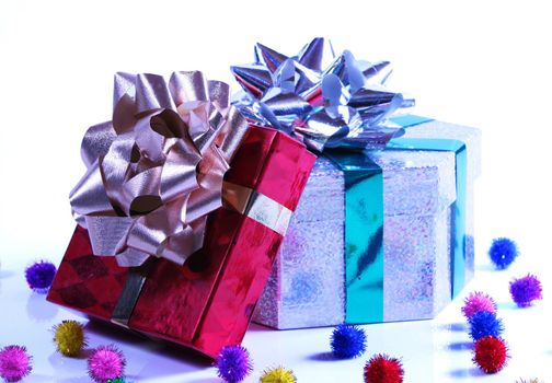 Shiny presents with ribbons and bows on white background.