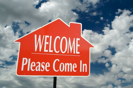 Welcome, Please Come In Real Estate Sign on a Cloudy Sky Background