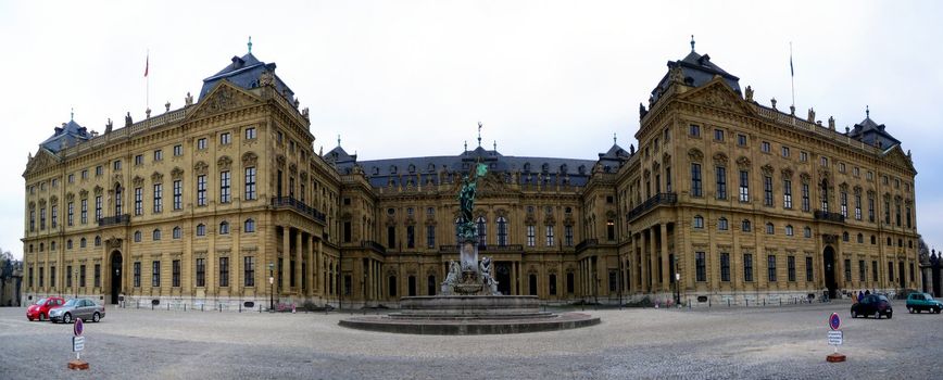 Panoramic capture of the Wuerzburger Residenz with fountain in foreground.