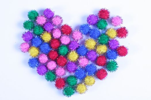 Multi- colored Heart formed from small color puff balls