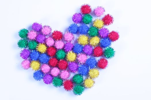 Multi- colored Heart formed from small color puff balls