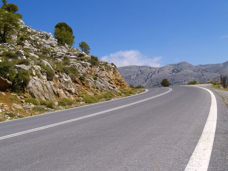 road in cretan mountains on a bright sunny day